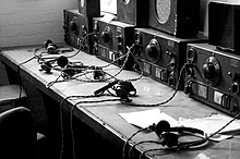 British radio listening station from the Second World War, equipped with the National HRO shortwave radio receivers Operators are standing by.jpg