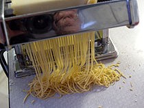 Dough being extruded from a pasta machine