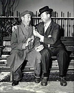 Red Skelton as Freddie the Freeloader with Allen Jenkins as his friend, Muggsie, in a 1958 enactment of the story on Skelton's television program. Red Skelton Allen Jenkins Cop and the Anthem 1958.JPG