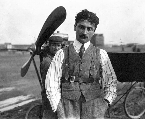 Roland Garros in front of a Demoiselle plane in 1910