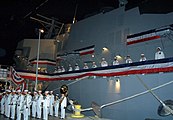 U.S. Navy sailors man the rails of the training simulator, USS Trayer (BST-21), which was completed in June 2007