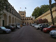 Car park at San Anton Palace, with the wall that collapsed in October 2018 on the right San Antonio Palace and Gardens - stables, tower, private car park.jpg