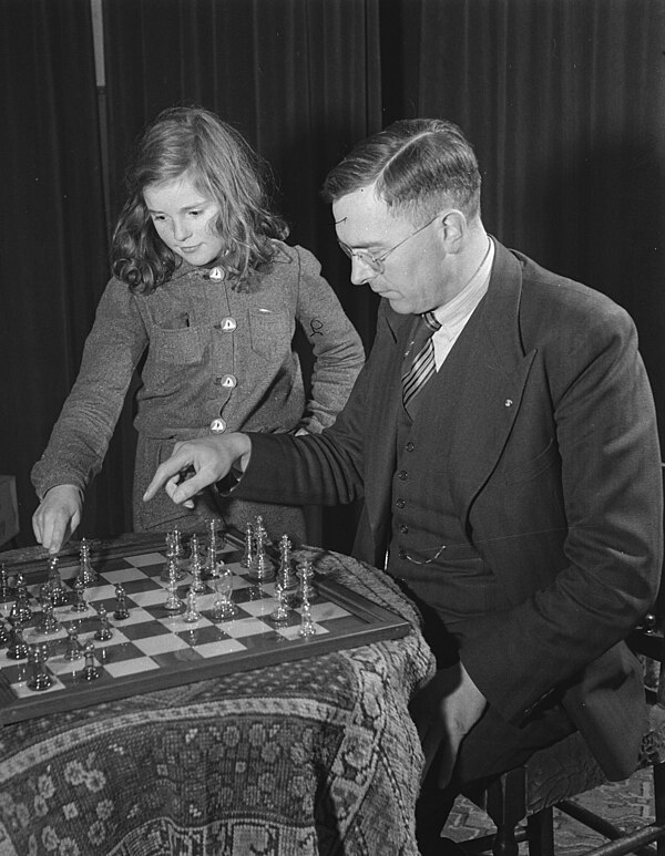 Menchik had two wins against Max Euwe (pictured in 1945 with his daughter), the World Champion from 1935 to 1937, in four tournament games. For this r