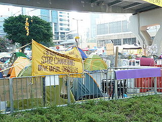 Parody of police banner: "Stop Charging or We Unfurl Umbrellas"
