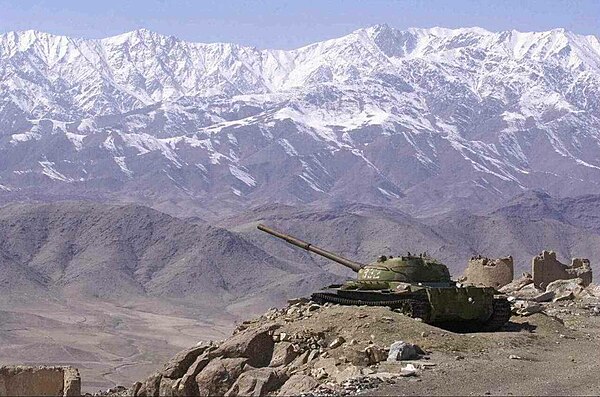 Landscape of Afghanistan with a T-62 tank in the foreground