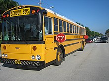 An American school bus displaying front and rear folding stop signs Thomas School Bus Bus.jpg