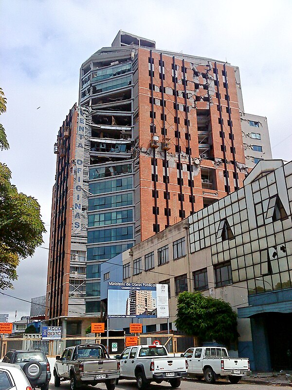 The partially collapsed 21-story O'Higgins Tower, Concepción