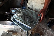 A Marine holding two UGR-H&S rations USMC-120511-M-RU378-305.jpg