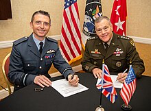 Godfrey (left) with Gen. James Dickinson, U.S. Space Command commander (right), in April 2022 USSPACECOM Signs MOU with United Kingdom (7137166).jpeg