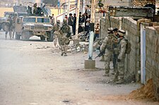 U.S. Marines prepare to conduct house calls in Ramadi, 18 February 2005 US Marines prepare for 'house calls' Operation River Blitz.jpg