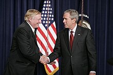 Buckley shaking hands with President George W. Bush on October 6, 2005