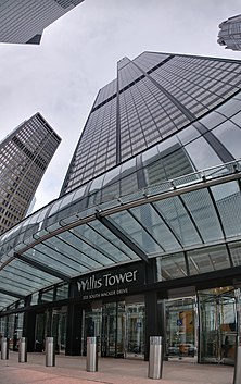 Skyward view from the foot of a skysraper that reads Willis Tower 233 South Wacker