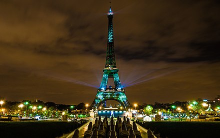 The Eiffel Tower lit with green lights during COP21.
