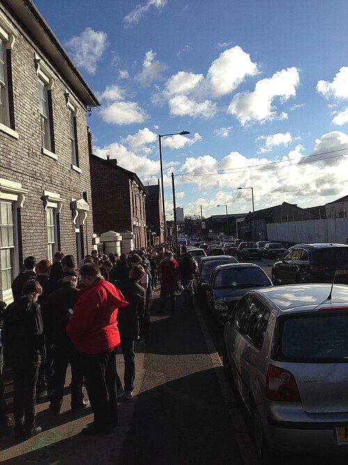 Candidates for roles as teenage male extras queuing in Birmingham