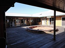 Former courtyard with former big boys dorm in centre and former recreation hall on right 1875 - Kinchela Aboriginal Boys' Training Home - Former courtyard with former big boys dorm in centre and former recreation hall on right. (5054659b1).jpg