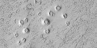 Close view of cones, as seen by HiRISE under HiWish program These cones probably formed when hot lava flowed over ice-rich ground.