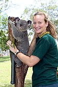 Koala at Featherdale Wildlife Park with park staff member