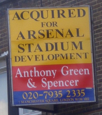 A board displaying the acquisition of the Ashburton Grove site for the stadium development.
