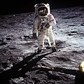 Buzz Aldrin on the moon, with Neil Armstrong reflected in his helmet
