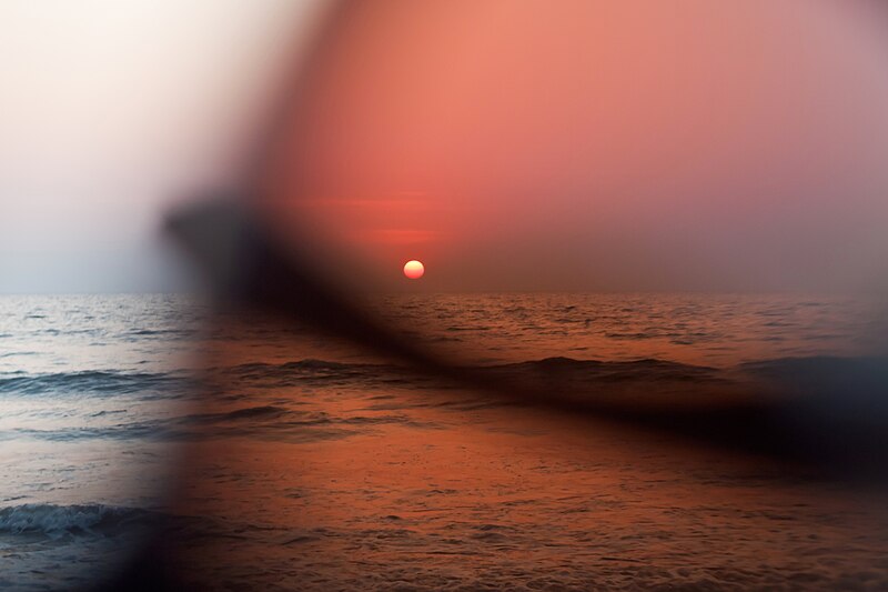 File:Anjuna, Goa, India, Sunset on the beach through eyeglasses.jpg