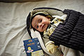 Baby with completed vaccine card (9295966469).jpg
