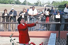NYRA bugler Sam Grossman plays "Call to the Post", heralding the horses as they enter the track before a race at Belmont Park. Belmontsam May 1999.jpg