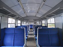 The interior of a 1966 British Rail Class 421 train carriage, used in the film British Rail CIG Class 421 Standard Class Interior.jpg