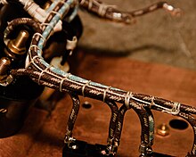 Laced wiring harness from a Tesla coil Cable lacing close-up.jpg