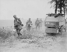 Canadian troops supported by an Armoured Autocar go into action at the Battle of Amiens