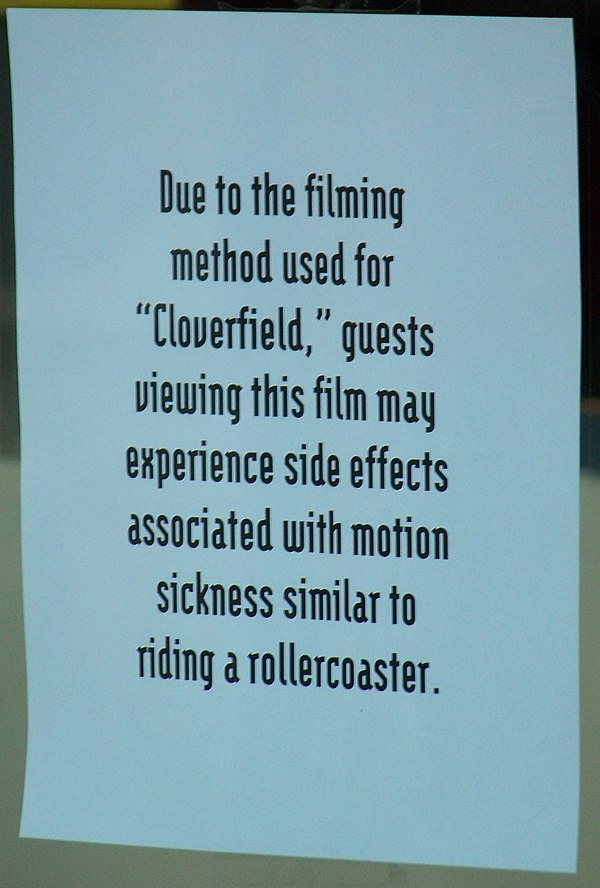 Sign at an AMC theater warning customers about side effects relating to motion sickness due to the shaky camera technique being used in Cloverfield.