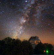 The Milky Way appears to cascade down the skies above Kitt Peak National Observatory (KPNO)