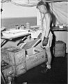 Dr Arthur D Welander inspecting fish in a lab aboard the USS CHILTON, probably in the vicinity of Bikini Atoll, summer 1947 (DONALDSON 61).jpeg