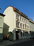 Apartment building in half-open development