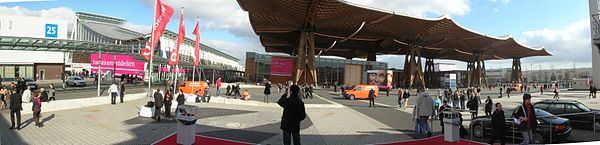 Open exhibition area at the Hanover Fairground featuring the famous Expo 2000 wooden roof