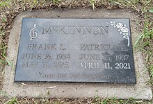 Flat black granite marker inscribed with names of McKinnon and his wife