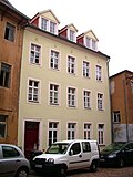 Residential house in half-open development (narrow building wicket to No. 35)