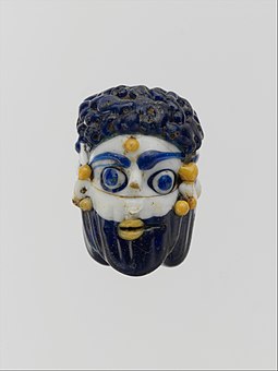 Face bead; mid-4th–3rd century BC; glass; height: 2.7 cm; Metropolitan Museum of Art