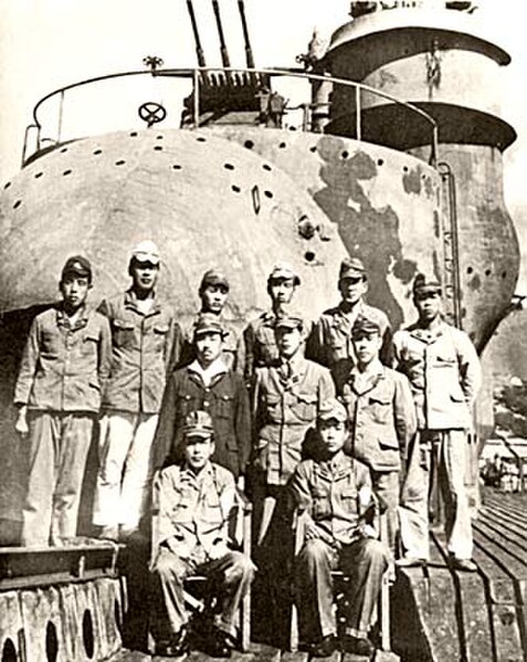 The officers of I-400, photographed in front of her aircraft hangar after her surrender to the U.S. Navy in August 1945.