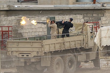 Iraqi Army fire a heavy machine at ISIS positions in Mosul.jpg