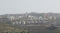 al-Rayhan suburb of Ramallah from the west. The big building on the right is Istishari Arab Hospital. On the left, behind the amusement park is the Arab American University.