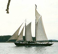 Gaff rigged schooner J. & E. Riggin. Her sails, from left to right, are: jib, staysail, gaff foresail, gaff mainsail, and, above that, a main gaff topsail