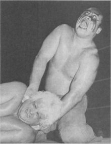 Kazuo Sakurada as Nagasaki during a 1982 match against Dusty Rhodes Kendo Nagasaki and Dusty Rhodes, 1982.png