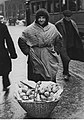 A street vendor with a basket of pączki (Warsaw 1934)