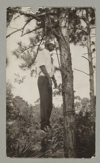 Lynching of James Clark July 11, 1926 Florida Large crowd looking at the burned body of Jesse Washington, 18 year-old African American, lynched in Waco, Texas, May 15, 1916 LCCN95517168.tif