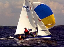 A Laser 2 flying its spinnaker, with the crew on the trapeze Laser II under spinnaker.jpg