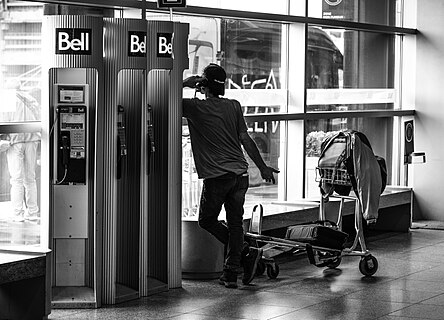 Man talking on the phone in Montréal-Pierre Elliott Trudeau International Airport