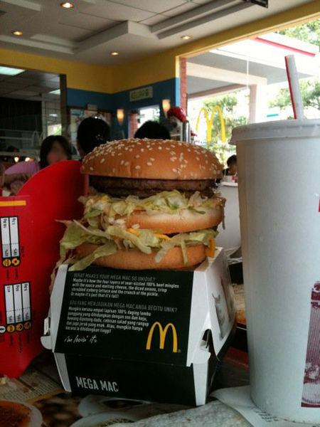 A Mega Mac burger with a large Coke and fries in Malaysia