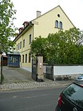 Residential house, outbuildings, garden, gate and fence