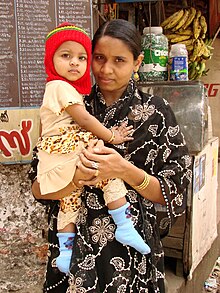 Women and children are particularly vulnerable to the health effects of toxic e-waste exposure. Mother and Child - Kozhikode - India.JPG