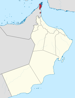 Musandam Governorate of Oman. The exclave of Madha is indicated in red below the Musandam Peninsula.
